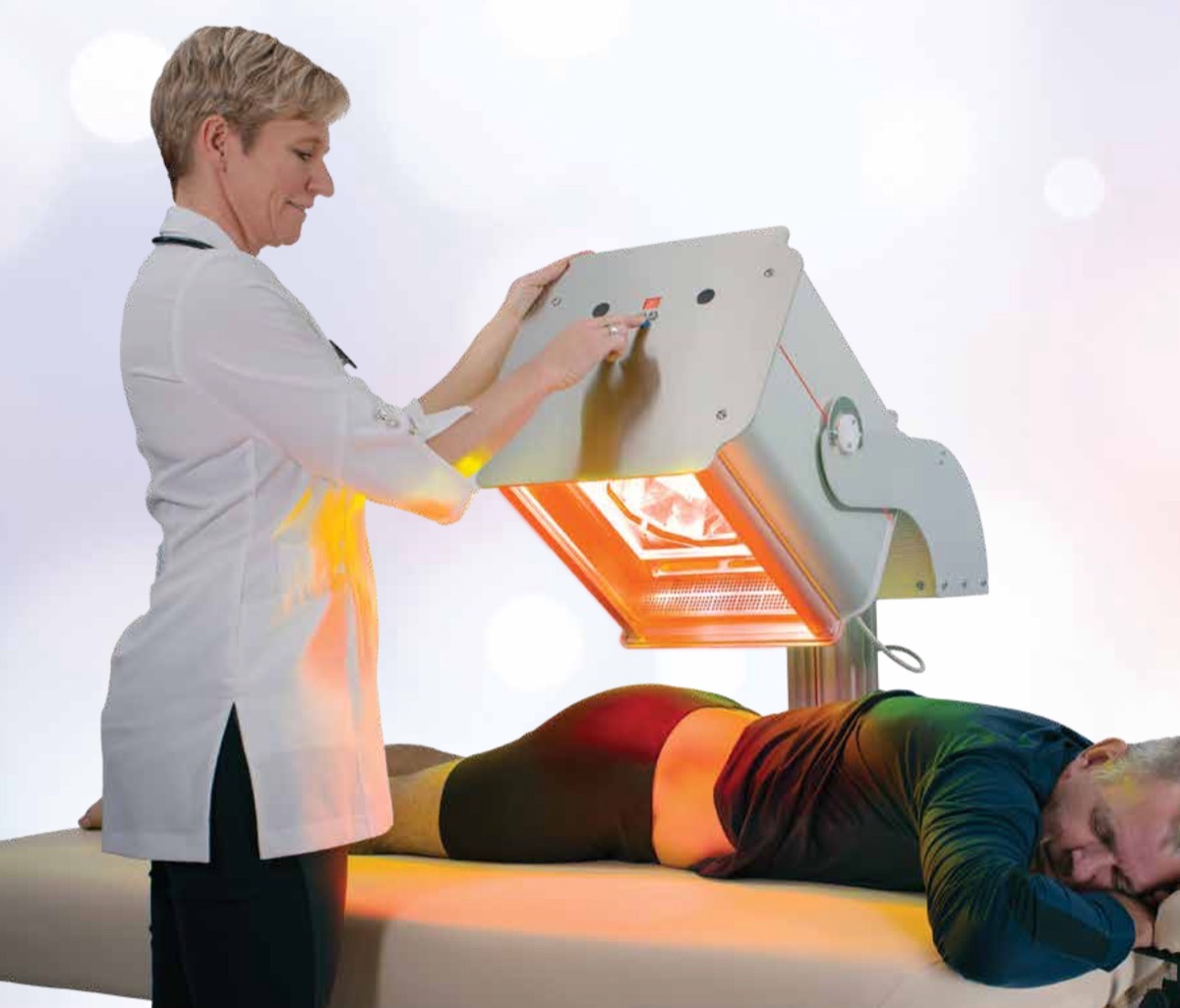 Practitioner adjusting the Collagentex RX-1 over a patient lying on a treatment table