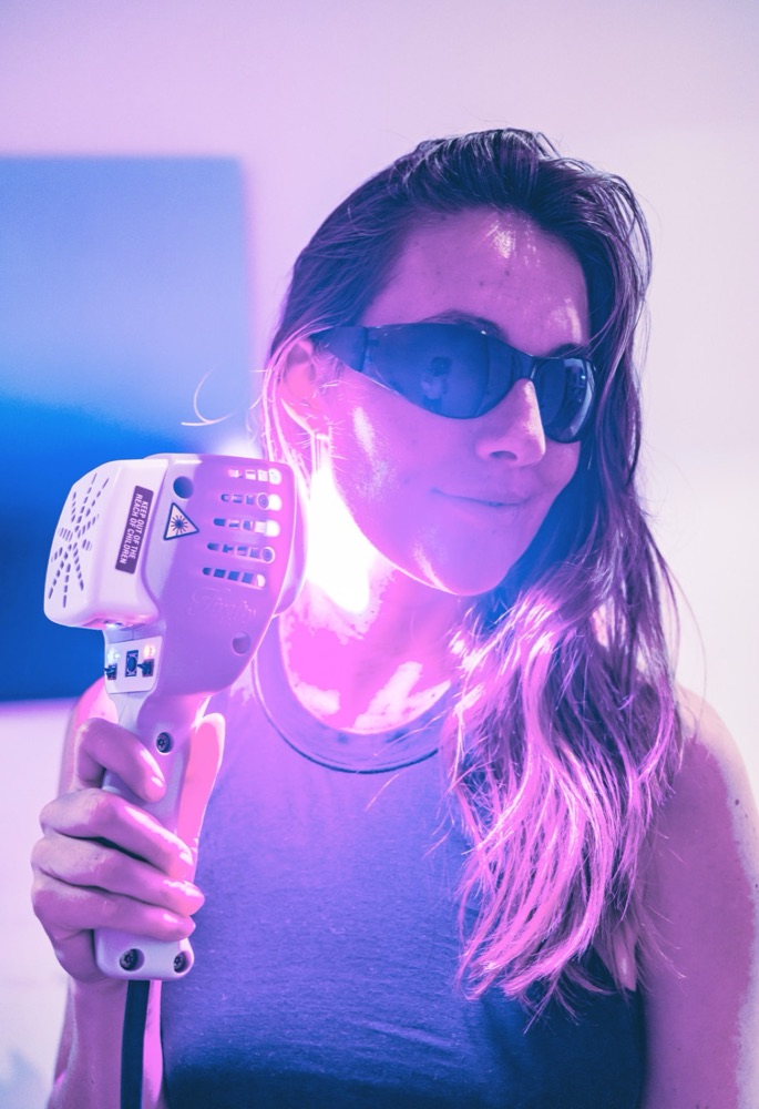 Firefly wand in use, with protective glasses worn during treatment